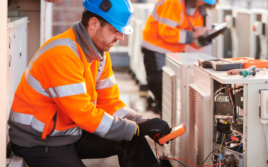 commercial aircon specialist doing maintenance check